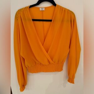 Orange cropped long sleeve shirt